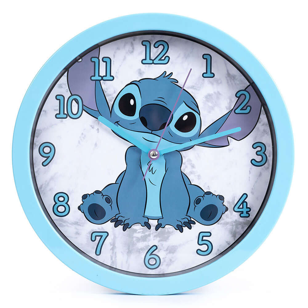 Lilo & Stitch Wall Clock LKT Sport Sky blue hanging wall clock featuring Stitch on the faceDurable plastic case with a clear font and modern quartz movementRequires x1 AA Battery (not included)Official licensed productApprox 25cm in diameter Wall Clocks