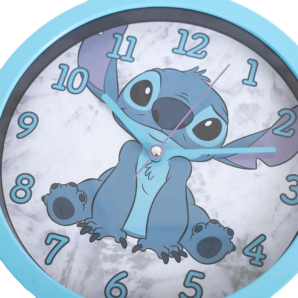 Lilo & Stitch Wall Clock LKT Sport Sky blue hanging wall clock featuring Stitch on the faceDurable plastic case with a clear font and modern quartz movementRequires x1 AA Battery (not included)Official licensed productApprox 25cm in diameter Wall Clocks