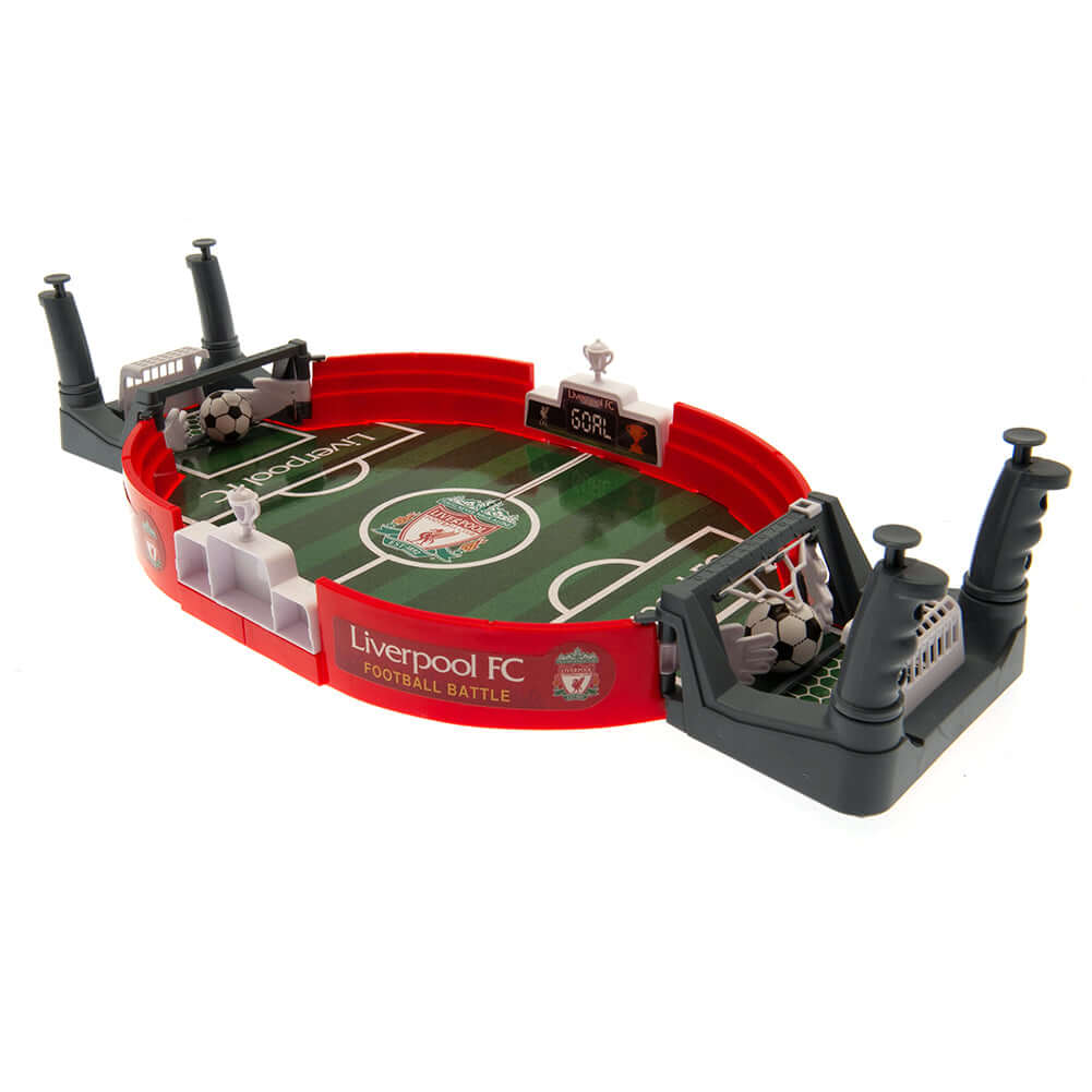 Liverpool FC Mini Football Game LKT Sport Table top football game in a branded pitch designFun 2 player game, aged 3 upwardsEasy to assemble constructionIncludes a sliding score indicator at either endComplete with two plastic ballsOfficial licensed produ Main image