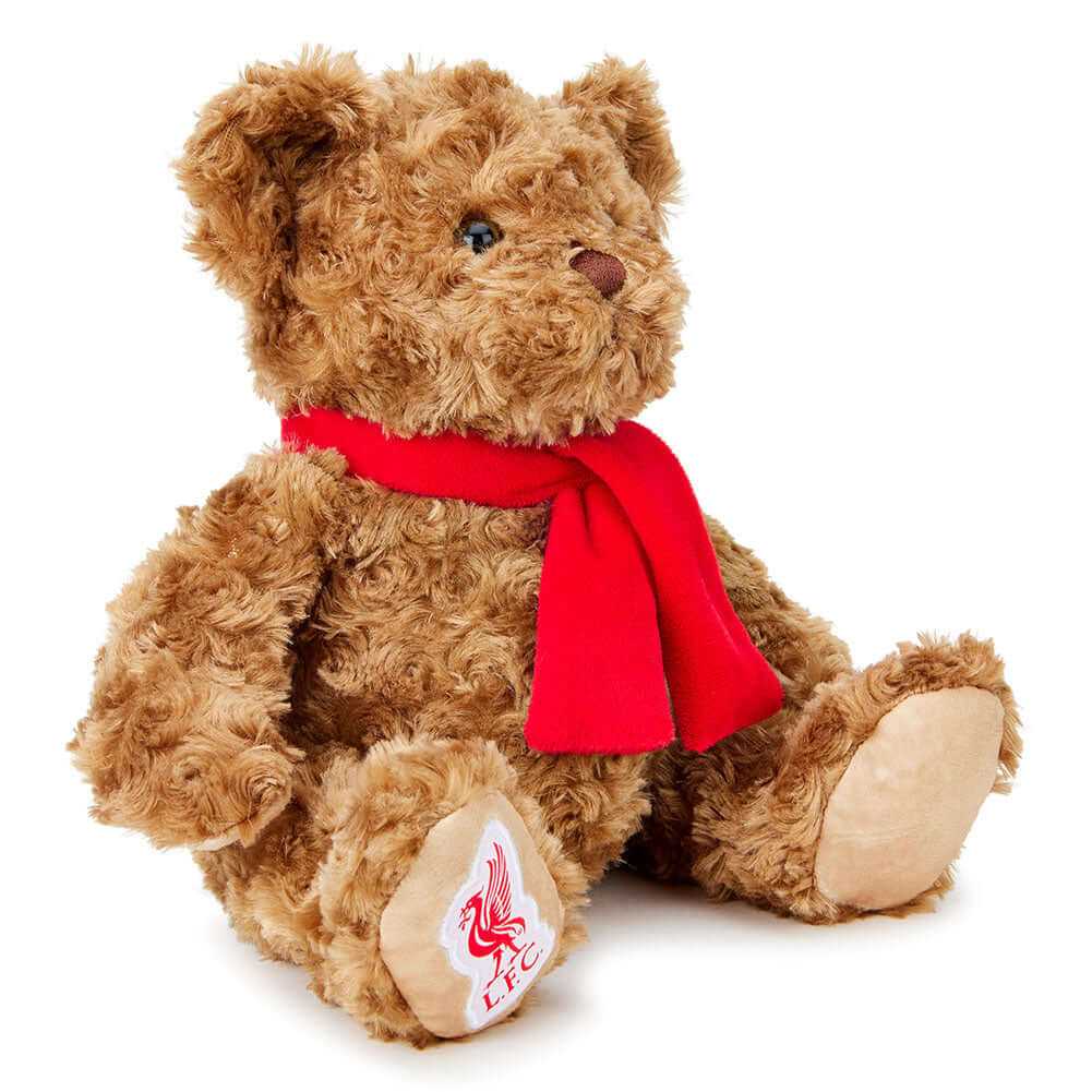 Liverpool FC Supersoft Classic Bear LKT Sport Super soft classic bear in sitting position with beaded eyesWearing a vibrant red scarf with a Liverbird and L.F.C. on the bears paw100% polyesterOfficial licensed productApprox 25cm in sitting position Stuffe