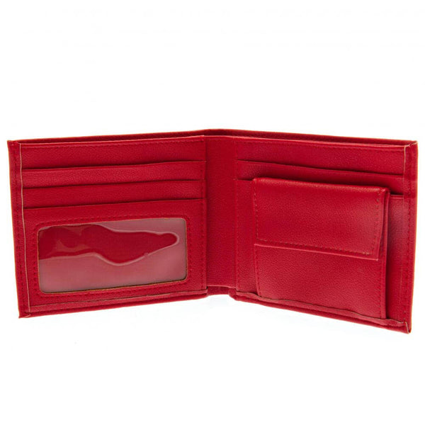Liverpool FC This Is Anfield Wallet LKT Sport Red PU wallet featuring a large printed retro club crest3 card slots, a window slot and 2 note pocketsChange pocket with secure stud fastener2 additional compartmentsOfficial licensed productApprox 11cm x 9cm