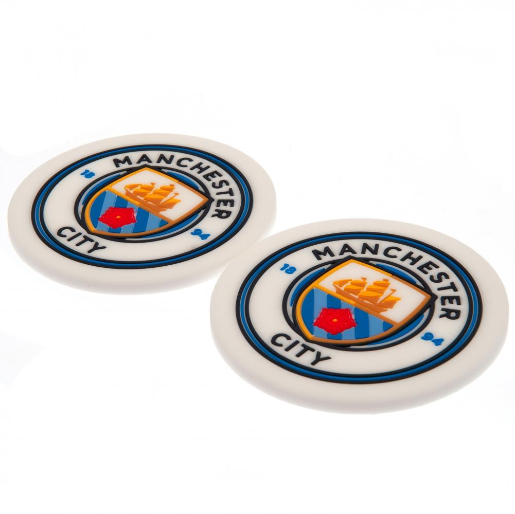 Manchester City FC 2pk Coaster Set LKT Sport Pack of 2 flexible non slip silicone coasters Vibrant colour coasters each with a stamped City crest Wipe clean finish Official licensed product Approx 10cm in diameter On a header card Coasters