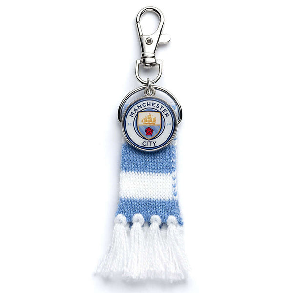 Manchester City FC Blue Bar Scarf Bag Charm LKT Sport Blue and white bar scarf design bag charmWith a full colour City crest charm and lobster claw claspOfficial licensed productApprox 60mm x 30mm Keychains
