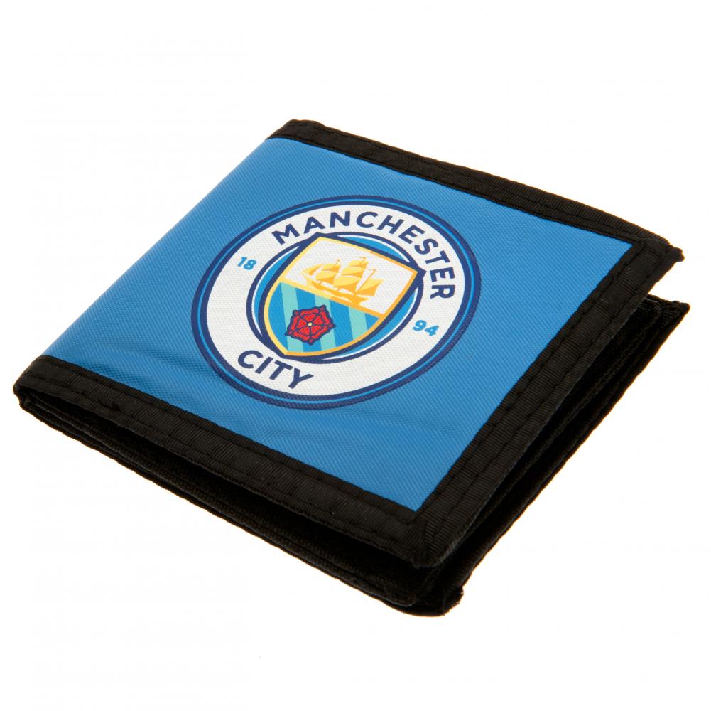 Manchester City FC Canvas Wallet LKT Sport Sky blue wallet with black trim featuring full colour Man City club crest Internal window compartment and 2 zipped pockets 9 additional separate internal compartments Wipe clean polyester Official licensed produc Hauptbild