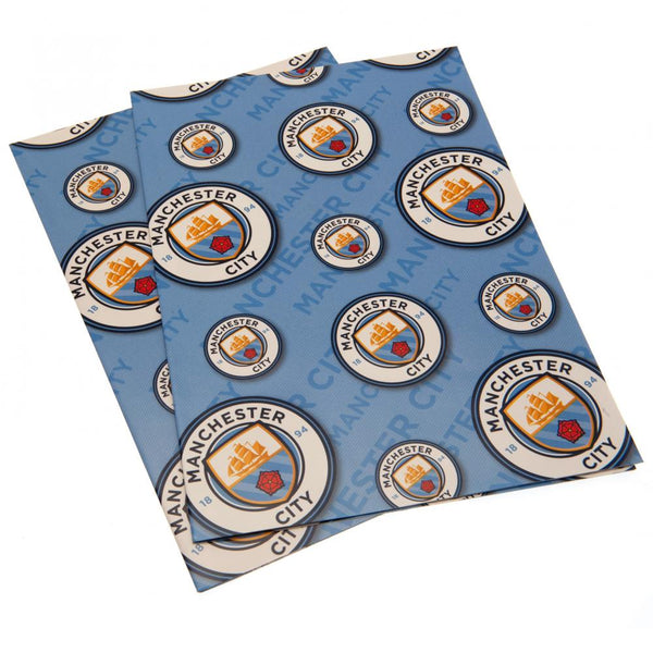 Manchester City FC Crest Gift Wrap LKT Sport Vibrant, colourful gift wrap sheets with tags2 sheets of wrap featuring multiple City crests on a blue backgroundComplete with 2 blue gift tags featuring the City crestOfficial licensed productApprox 70cm x 50c