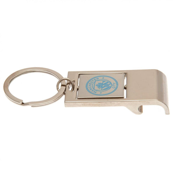 Manchester City FC Executive Bottle Opener Keyring LKT Sport Metal keyring with bottle opener function Spinning design with full colour crest print Official licensed product Approx 7cm x 3cm In a gift box Keychains