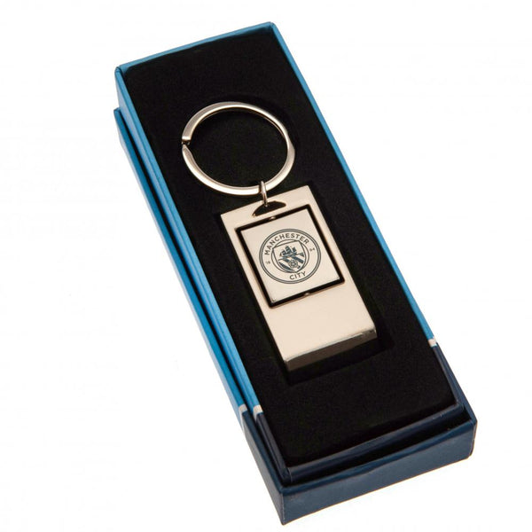 Manchester City FC Executive Bottle Opener Keyring LKT Sport Metal keyring with bottle opener function Spinning design with full colour crest print Official licensed product Approx 7cm x 3cm In a gift box Keychains