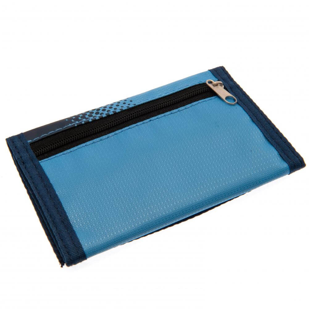 Manchester City FC Fade Wallet LKT Sport Fade design wallet featuring Man City text and full colour club crest5 separate internal compartmentsExternal zipped pocketWipe clean polyesterOfficial licensed productApprox 12cm x 8cm closed Wallets