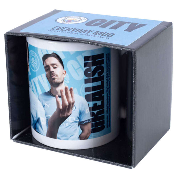 Manchester City FC Grealish Mug LKT Sport Ceramic everyday coffee mugBlue and white mug featuring images of Jack Grealish with a City crest and textGlazed kiln fired finish with white handleOfficial licensed productApprox 315ml (11oz)Approx 9cm tall, 8cm