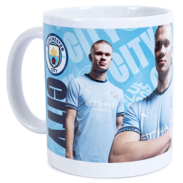 Manchester City FC Haaland Mug LKT Sport Ceramic everyday coffee mugBlue and white mug featuring images of Erling Haaland with a City crest and textGlazed kiln fired finish with white handleOfficial licensed productApprox 315ml (11oz)Approx 9cm tall, 8cm