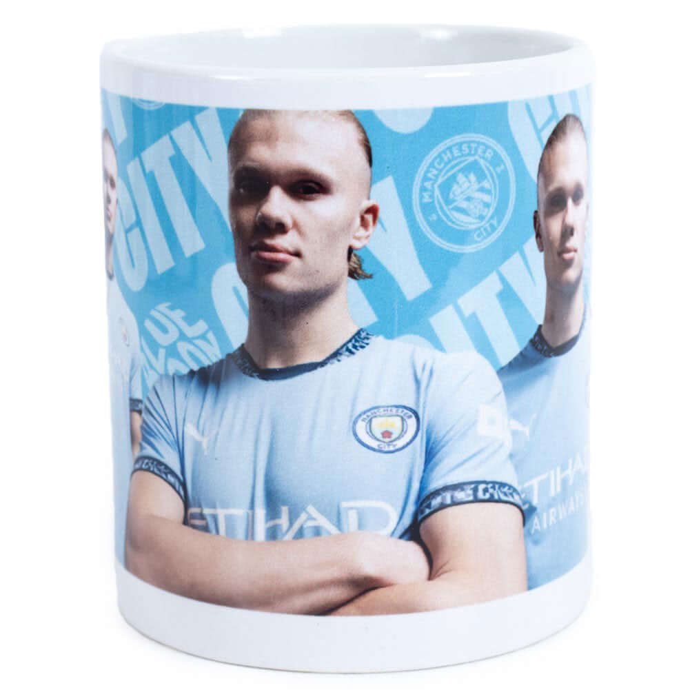 Manchester City FC Haaland Mug LKT Sport Ceramic everyday coffee mugBlue and white mug featuring images of Erling Haaland with a City crest and textGlazed kiln fired finish with white handleOfficial licensed productApprox 315ml (11oz)Approx 9cm tall, 8cm