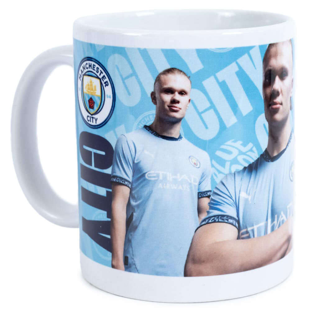 Manchester City FC Haaland Mug LKT Sport Ceramic everyday coffee mugBlue and white mug featuring images of Erling Haaland with a City crest and textGlazed kiln fired finish with white handleOfficial licensed productApprox 315ml (11oz)Approx 9cm tall, 8cm