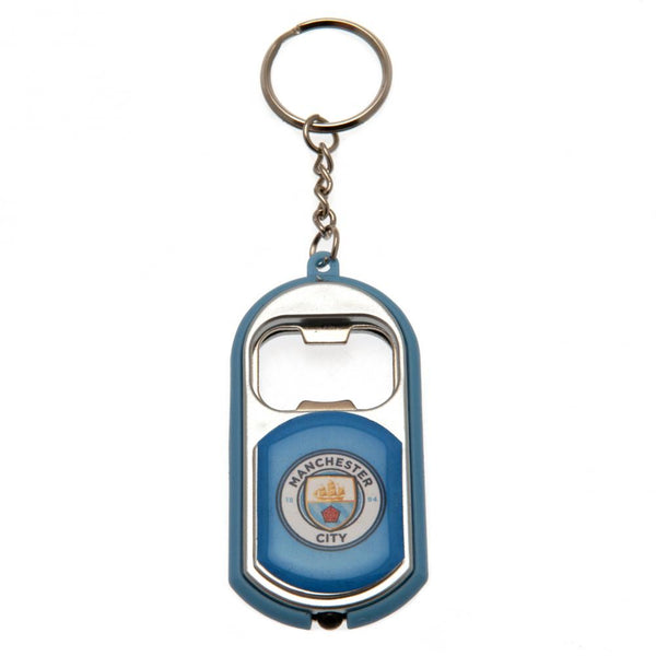 Manchester City FC Keyring Torch Bottle Opener LKT Sport Plastic club crested keyring With a bottle opener function Includes a battery powered torch Official licensed product Approx 7cm x 3cm In a gift box Keychains
