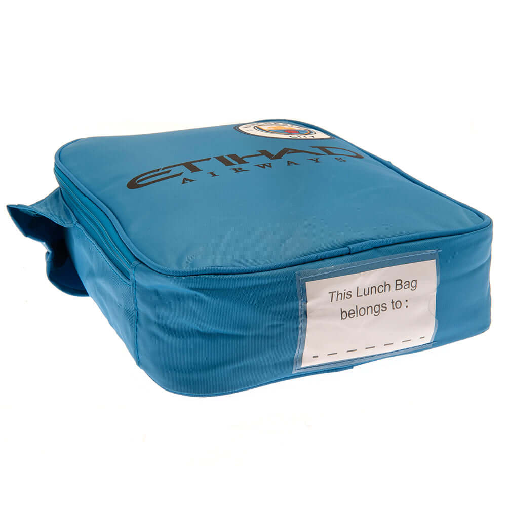 Manchester City FC Kit Lunch Bag LKT Sport Home shirt design lunch bag featuring Etihad Airways text and club crestDouble zipped opening for easy accessWith carry handle and name tagWipe clean polyesterOfficial licensed productApprox 29cm x 24cm x 7cm Lun