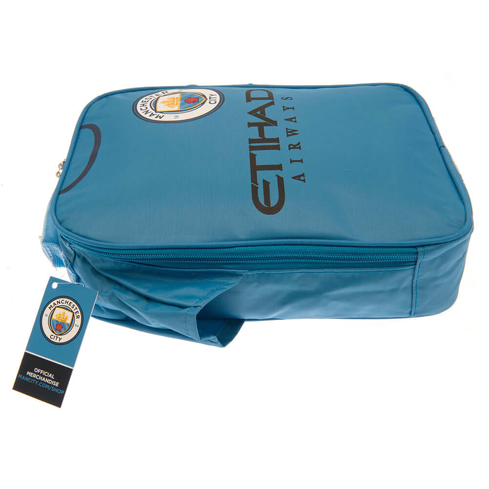 Manchester City FC Kit Lunch Bag LKT Sport Home shirt design lunch bag featuring Etihad Airways text and club crestDouble zipped opening for easy accessWith carry handle and name tagWipe clean polyesterOfficial licensed productApprox 29cm x 24cm x 7cm Lun