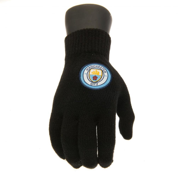Manchester City FC Knitted Gloves Junior LKT Sport Childrens black knitted gloves Featuring a full colour Man City club crest Official licensed product Junior one size fits all With a swing tag Gloves & Mittens