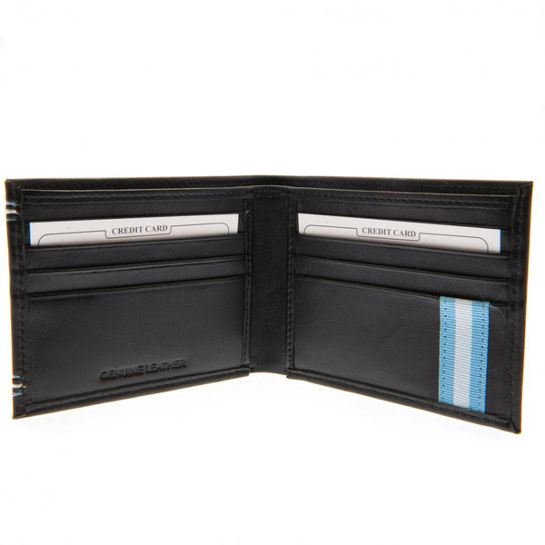 Manchester City FC Leather Stitched Wallet LKT Sport Leather wallet featuring sky blue and white stitching detail and embossed club crest 6 card slots and 2 cash compartments 2 additional compartments Official licensed product Approx 11cm x 9cm In a displ
