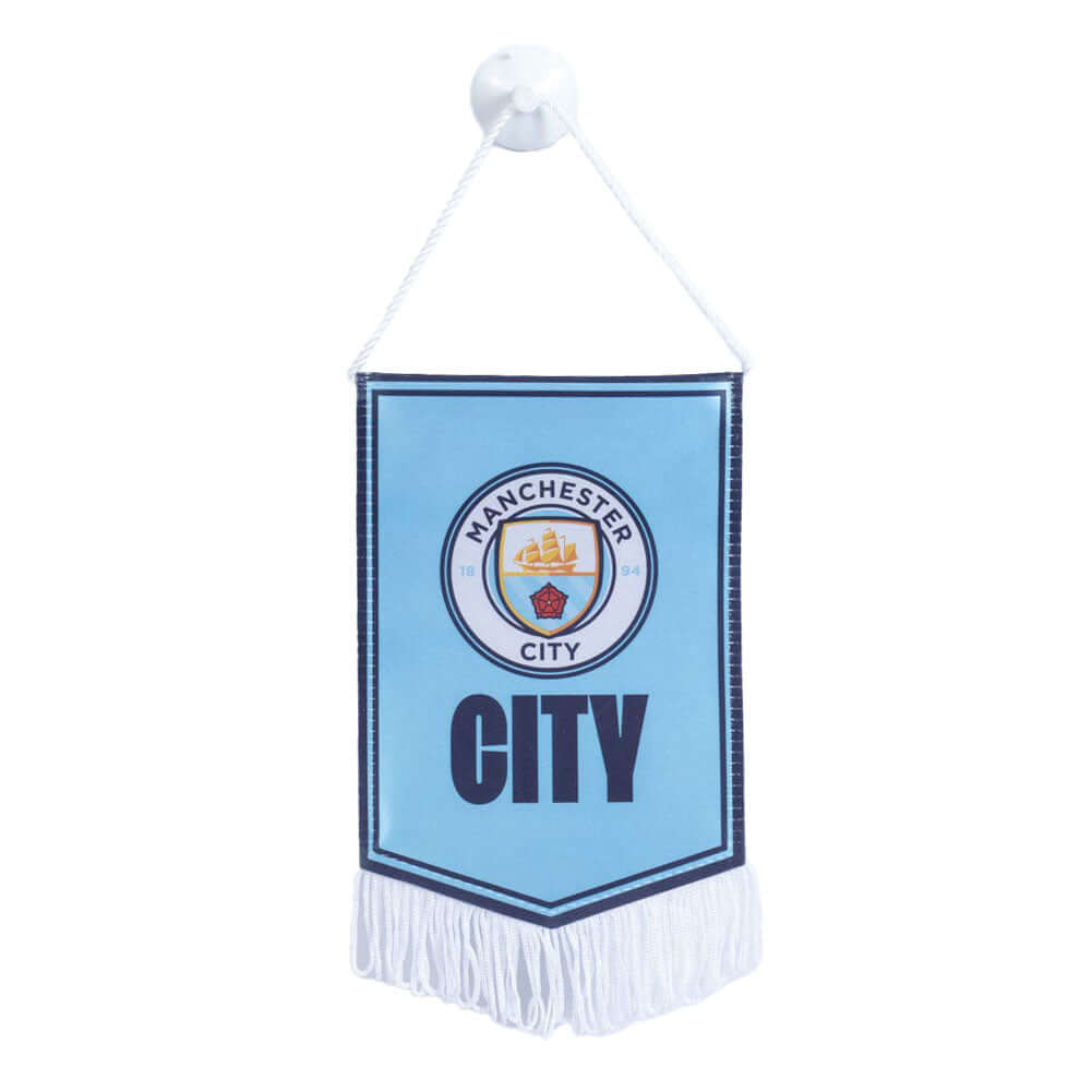 Manchester City FC Mini Pennant LKT Sport Satin look crest design pennantFeaturing a full colour Man City crest with the text CITY underneath on a sky blue backgroundFinished with white tassels and hanging stringIdeal for your car or windowOfficial licens