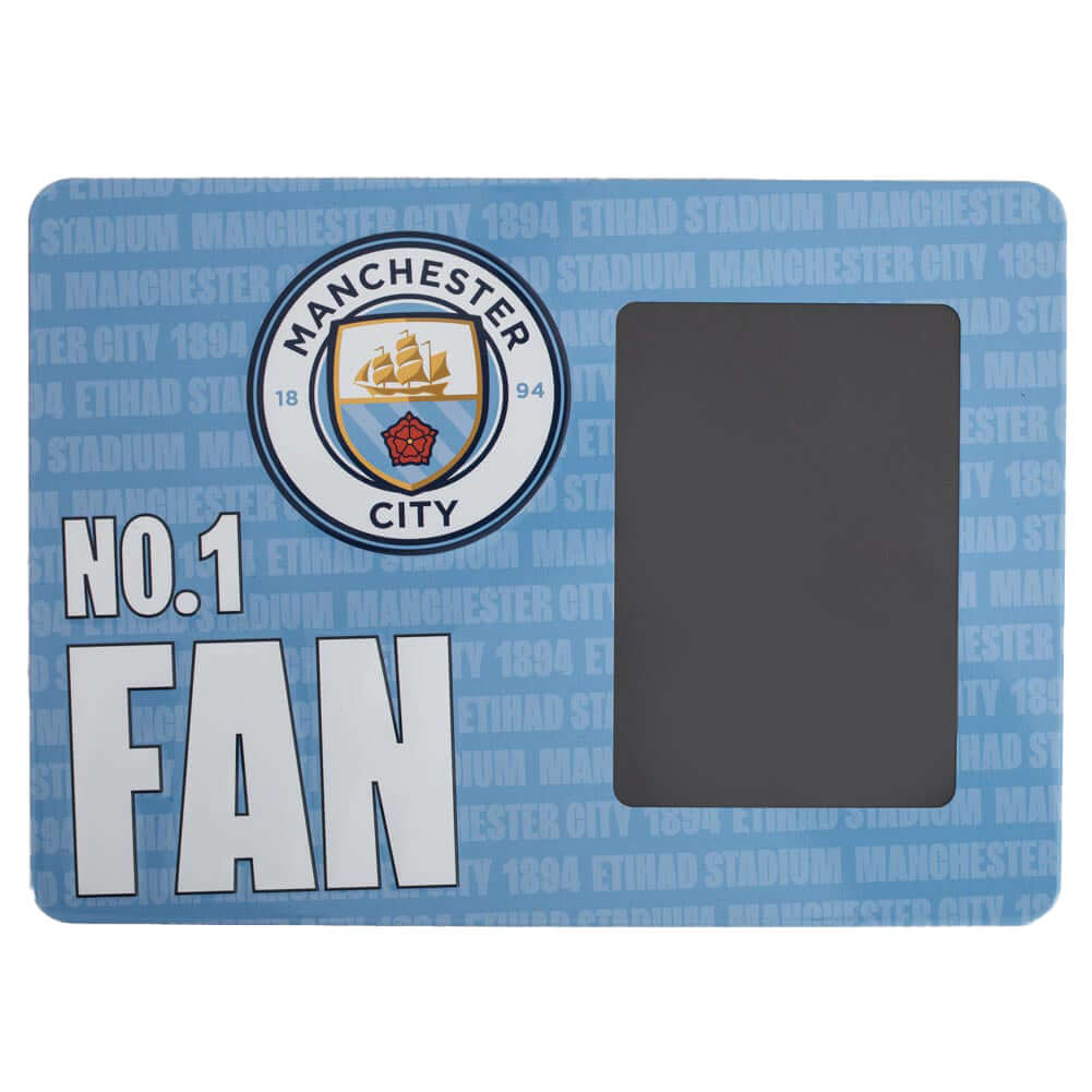 Manchester City FC No1 Fan Picture Frame Sign LKT Sport Sturdy metal photo frame sign featuring the Man City crest and NO.1 FAN in bold white textIncludes the text 'Manchester City 1894 Etihad Stadium' as a repeat pattern in the backgroundWith a portrait