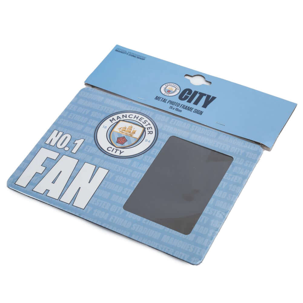 Manchester City FC No1 Fan Picture Frame Sign LKT Sport Sturdy metal photo frame sign featuring the Man City crest and NO.1 FAN in bold white textIncludes the text 'Manchester City 1894 Etihad Stadium' as a repeat pattern in the backgroundWith a portrait