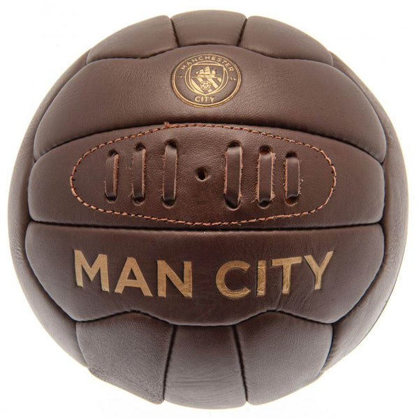 Manchester City FC Retro Heritage Football LKT Sport Genuine leather heritage footballFeaturing gold debossed print Man City crest and text18 panel retro style ball with stitched featureOfficial licensed productSize 5 footballApprox 69cm in circumference