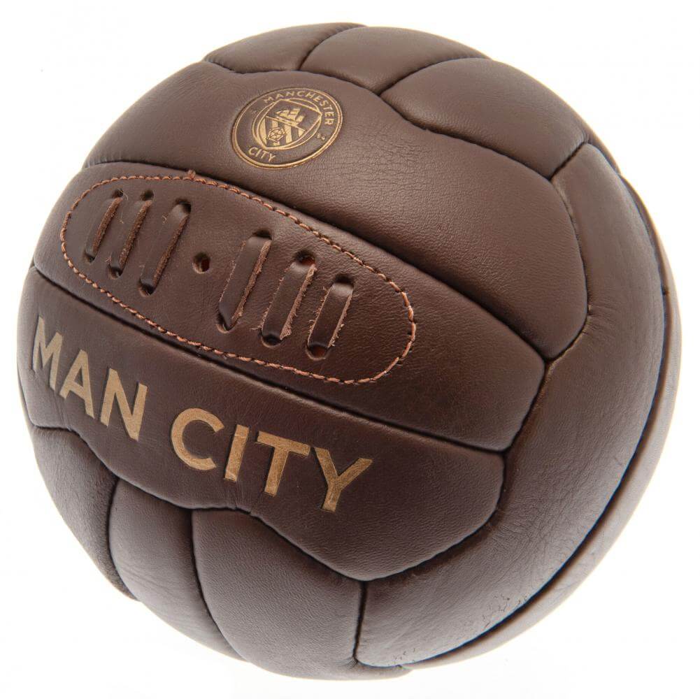 Manchester City FC Retro Heritage Football LKT Sport Genuine leather heritage footballFeaturing gold debossed print Man City crest and text18 panel retro style ball with stitched featureOfficial licensed productSize 5 footballApprox 69cm in circumference
