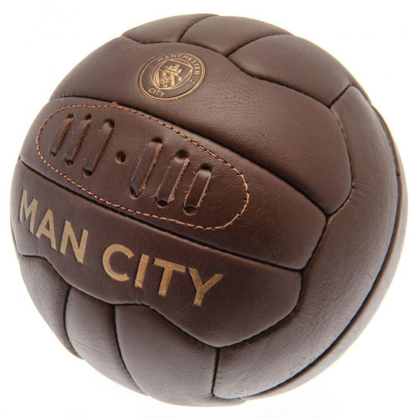 Manchester City FC Retro Heritage Football LKT Sport Genuine leather heritage footballFeaturing gold debossed print Man City crest and text18 panel retro style ball with stitched featureOfficial licensed productSize 5 footballApprox 69cm in circumference