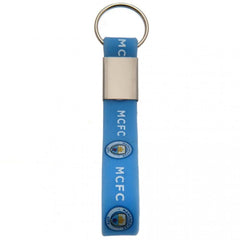 Manchester City FC Silicone Keyring LKT Sport Silicone strap keyring with silver colour metal band and split ring Vibrant sky blue strap with full colour crest and MCFC text design Official licensed product Approx 10cm x 1.5cm On a header card Keychains