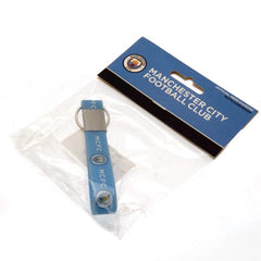 Manchester City FC Silicone Keyring LKT Sport Silicone strap keyring with silver colour metal band and split ring Vibrant sky blue strap with full colour crest and MCFC text design Official licensed product Approx 10cm x 1.5cm On a header card Keychains