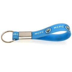 Manchester City FC Silicone Keyring LKT Sport Silicone strap keyring with silver colour metal band and split ring Vibrant sky blue strap with full colour crest and MCFC text design Official licensed product Approx 10cm x 1.5cm On a header card Keychains