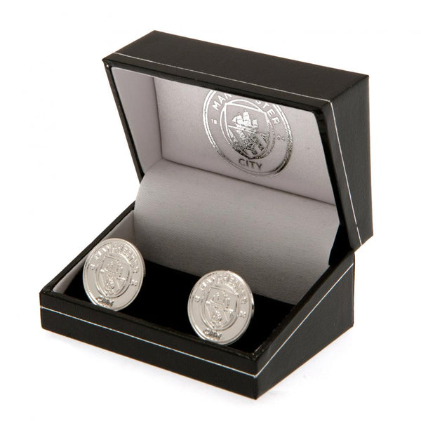 Manchester City FC Silver Plated Formed Cufflinks LKT Sport Silver plated crest shaped cufflinks in a chrome finish Featuring a highly detailed formed City crest On a bullet back fixing Official licensed product Approx 22mm x 18mm Presented in a gift box