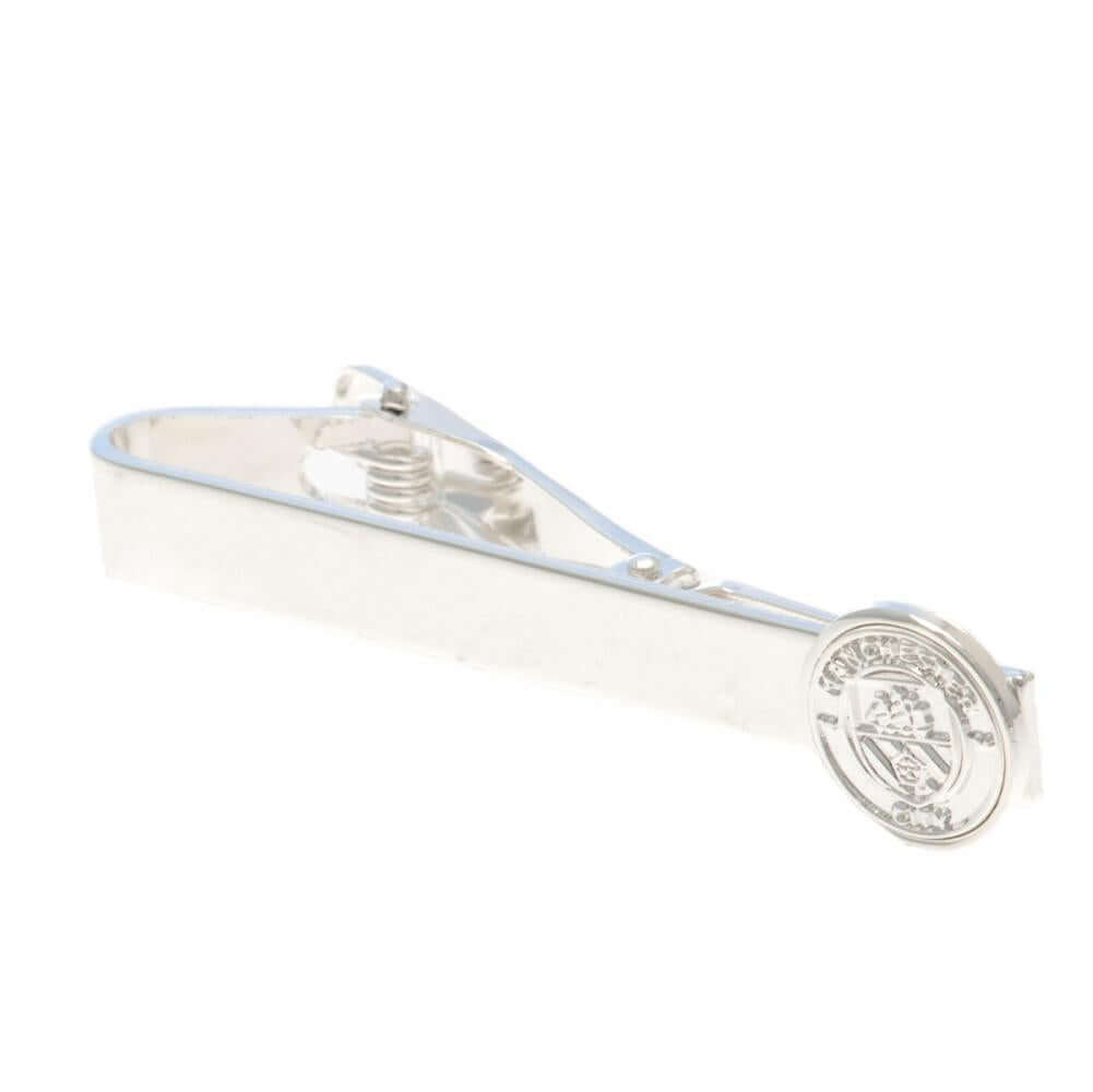Manchester City FC Silver Plated Tie Slide LKT Sport Classic design tie slide in a mirror finishSilver Plated pin featuring the City crestWith a crocodile clip backOfficial licensed productApprox 50mm x 12mm Tie Clips