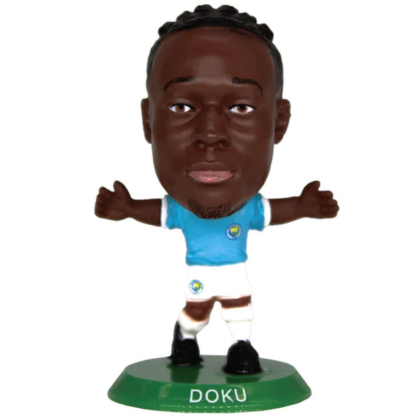 Manchester City FC SoccerStarz Doku LKT Sport Jérémy Doku Soccerstarz collectable figureFeatures classic Man City home kitStands 5cm tall on a green baseOfficial licensed productApprox 5cm x 2.5cm x 2.5cm Action Figures