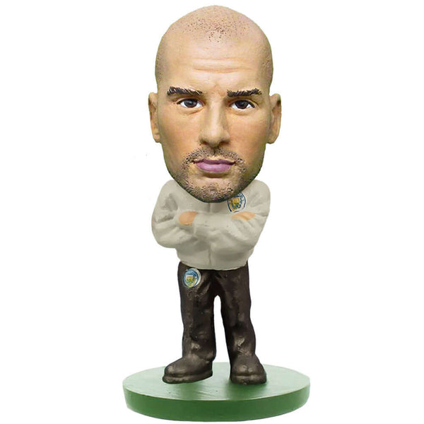 Manchester City FC SoccerStarz Guardiola Tracksuit LKT Sport Pep Guardiola Soccerstarz collectable figureFeatures Managers SuitStands 5cm tall on a green baseOfficial licensed productApprox 5cm x 2.5cm x 2.5cm Action Figures
