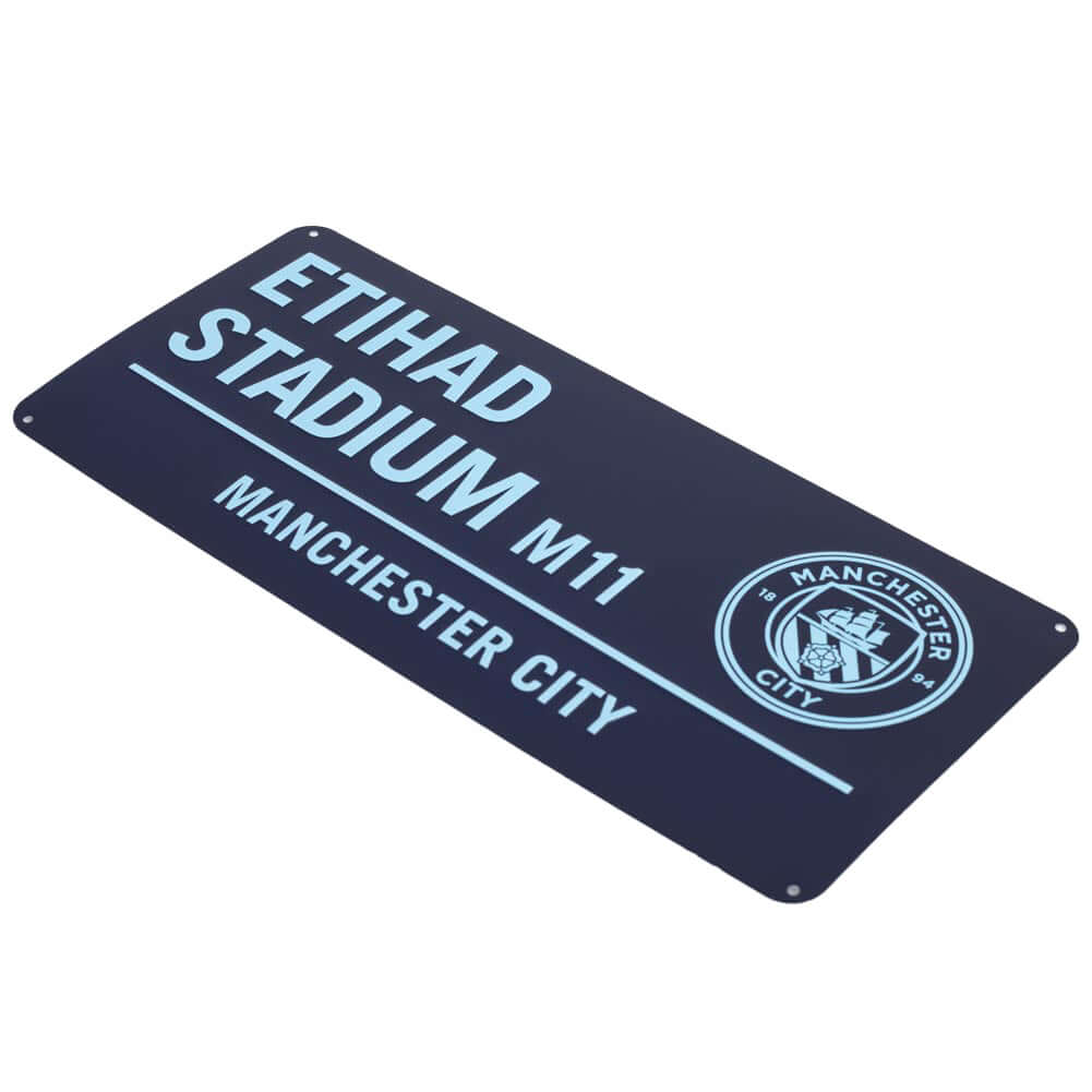 Manchester City FC Two Tone Street Sign LKT Sport Gloss finish design stamped metal wall signEtihad Stadium road sign, the home of Manchester City FC on a blue backgroundReady to hang on the wall with four small holes for fixingOfficial licensed productAp