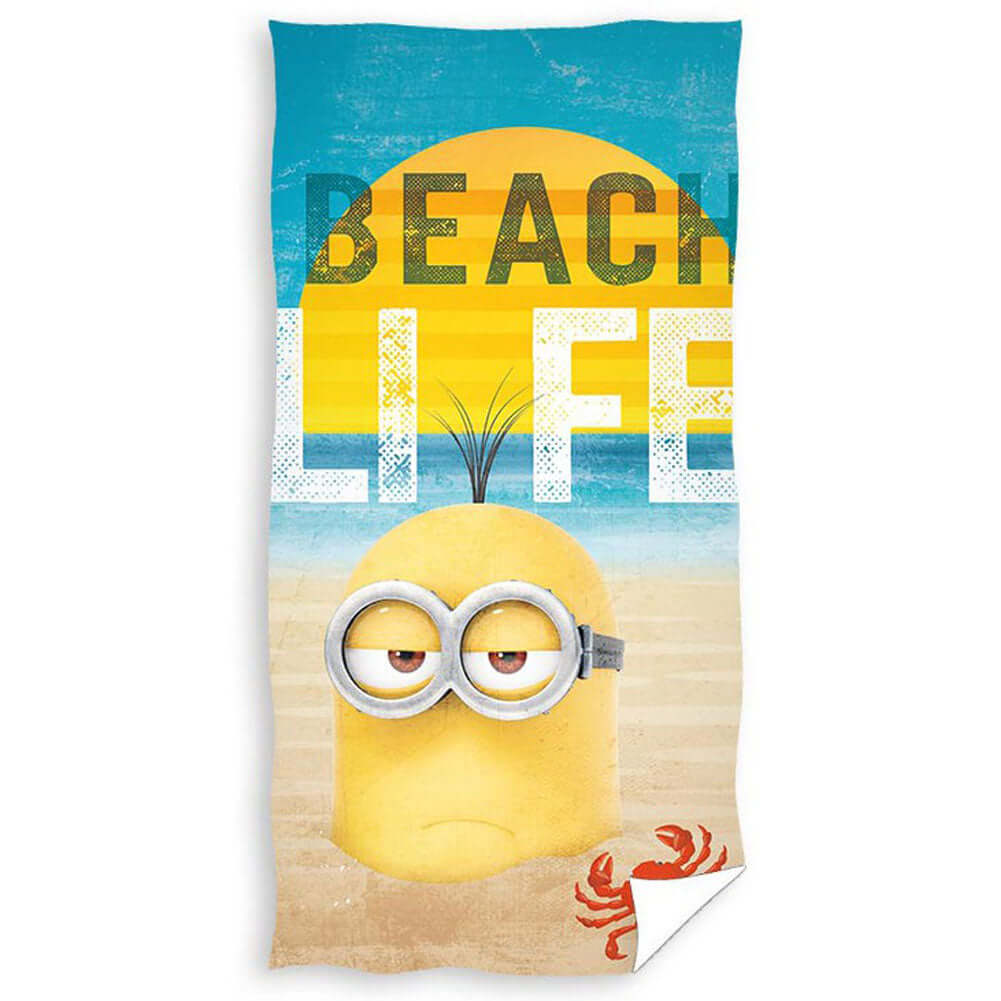 Minions Towel LKT Sport Large soft to touch velour beach towelBeach themed towel featuring the text 'Beach Life' with one of the Minions submerged in sandVibrant 100% cotton towelOfficial licensed productApprox 140cm x 70cm Beach Towels