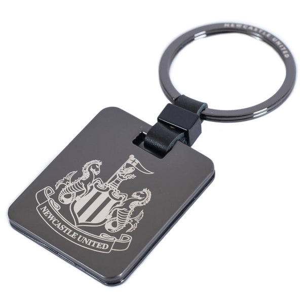 Newcastle United FC Galvanised Keyring LKT Sport Brushed gunmetal finish with a black leather link attachment and split ringfeatures the NUFC crest in a subtle greyOfficial licensed productApprox 35mm x 40mm Keychains