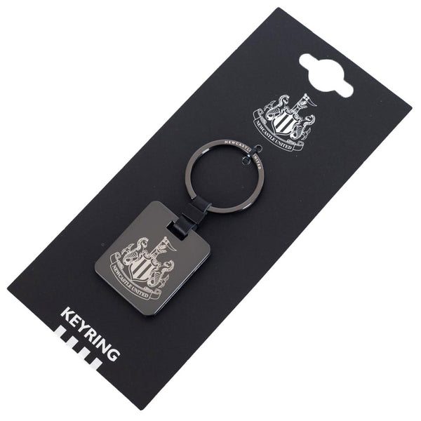 Newcastle United FC Galvanised Keyring LKT Sport Brushed gunmetal finish with a black leather link attachment and split ringfeatures the NUFC crest in a subtle greyOfficial licensed productApprox 35mm x 40mm Keychains
