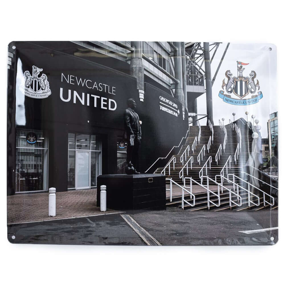 Newcastle United FC Sir Bobby Robson Large Sign LKT Sport Large metal St James' Park photo sign featuring the Sir Bobby Robson statueWith a full colour Newcastle United crest in the top right cornerReady to hang on the wall with four small holes for fixin