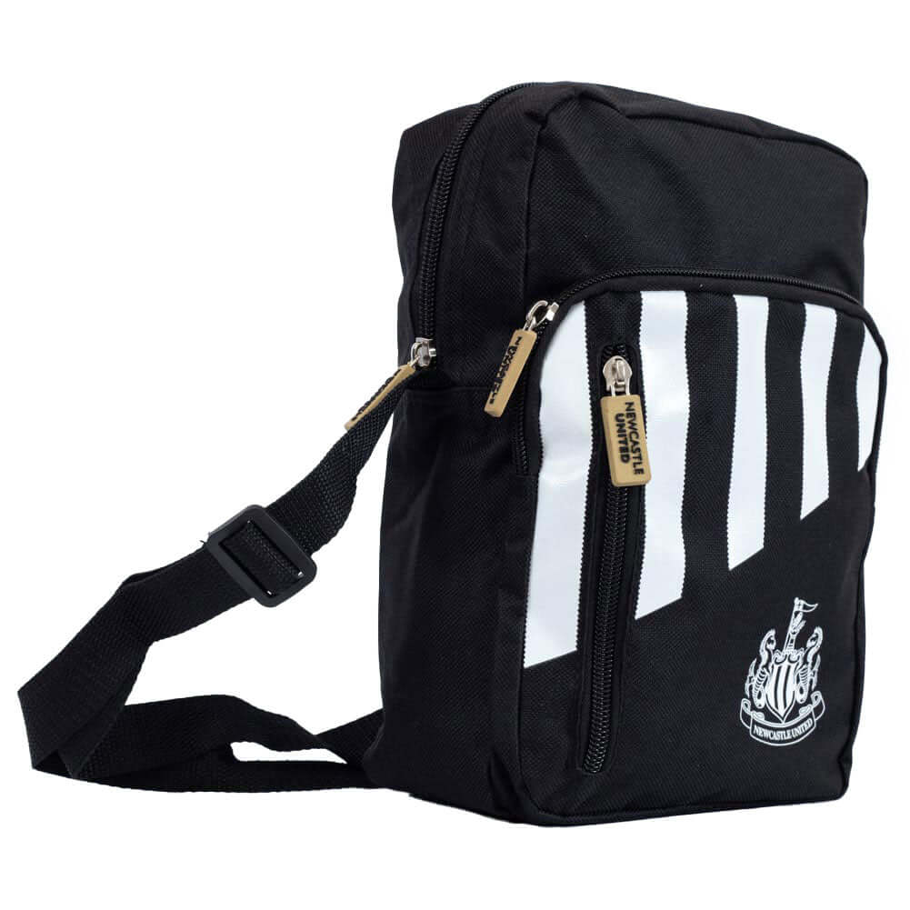 Newcastle United FC Stripe Shoulder Bag LKT Sport Black shoulder bag featuring a stripe design with a white Newcastle United crestMain compartment has a large double zipped opening for easy access2 front zip pockets and interior open pocketAdjustable shou
