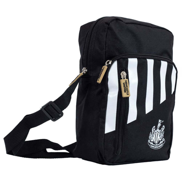 Newcastle United FC Stripe Shoulder Bag LKT Sport Black shoulder bag featuring a stripe design with a white Newcastle United crestMain compartment has a large double zipped opening for easy access2 front zip pockets and interior open pocketAdjustable shou