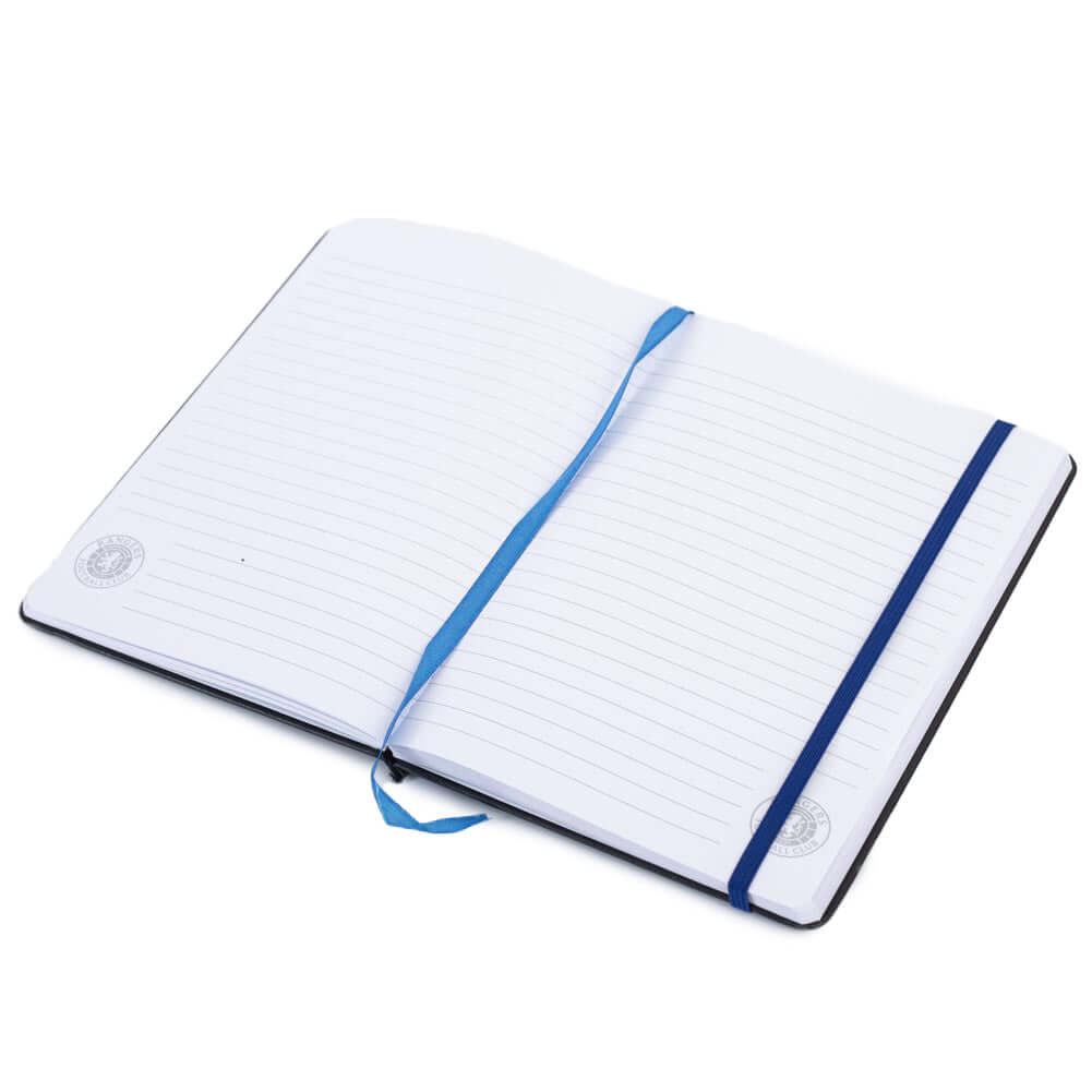 Rangers FC Classic Notebook LKT Sport Premium black faux leather hardback notebook with a royal blue embossed Rangers CrestRuled pages featuring a Rangers crest and a handy bookmarkComplete with an elastic closureOfficial licensed productApprox 14cm x 21c