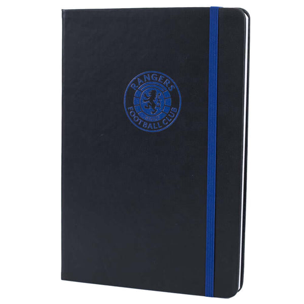 Rangers FC Classic Notebook LKT Sport Premium black faux leather hardback notebook with a royal blue embossed Rangers CrestRuled pages featuring a Rangers crest and a handy bookmarkComplete with an elastic closureOfficial licensed productApprox 14cm x 21c