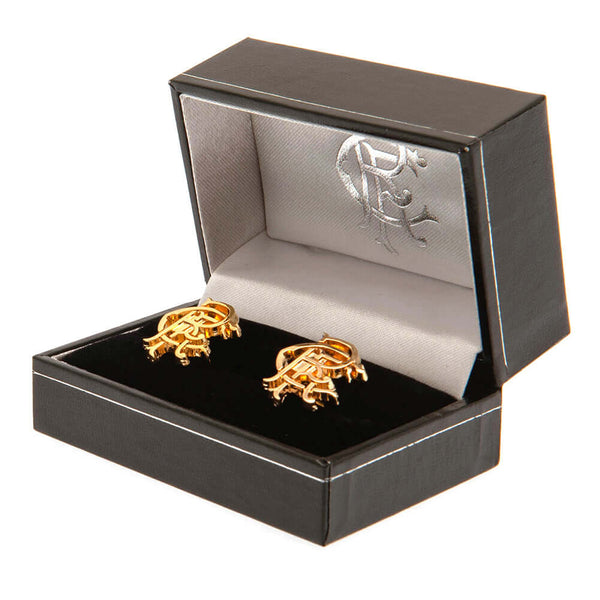 Rangers FC Gold Plated Scroll Crest Cufflinks LKT Sport Gold Plated crest shaped cufflinksFeaturing a highly detailed Rangers FC scroll crestOn a bullet back fixingOfficial licensed productApprox 20mm x 16mm Cufflinks