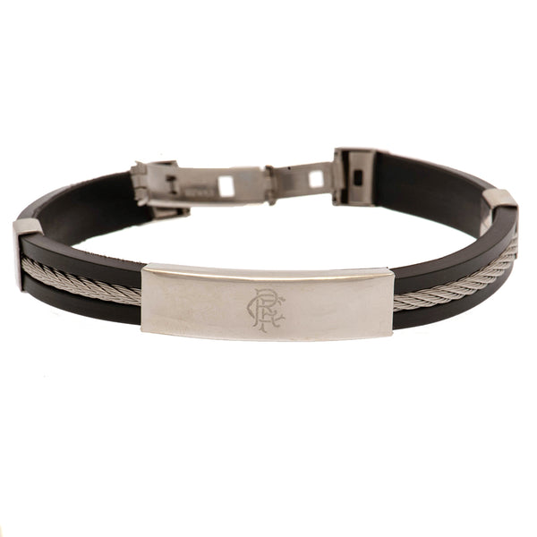 Rangers FC Silver Inlay Silicone Bracelet LKT Sport Stylish black silicone bracelet with a silver colour rope insertWith a stainless steel crest plate featuring the club logoStainless steel deployment claspOfficial licensed productApprox 20cm x 1cm Bracel