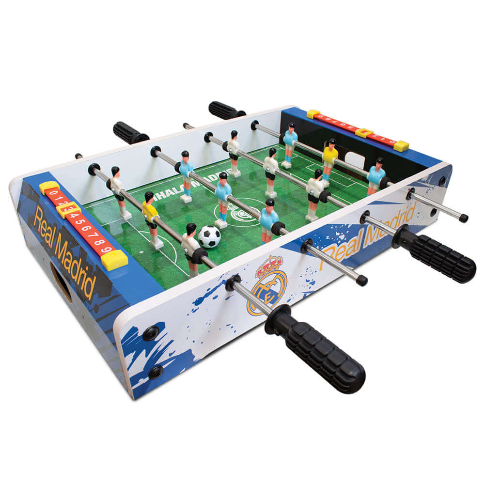 Real Madrid CF 20 inch Football Table Game LKT Sport Table top, football game featuring Real Madrid branding6 players per team in white or light blueSturdy construction with grass effect printed pitchA score indicator on each sideComplete with two plastic Main image