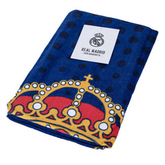 Real Madrid CF Blue Towel LKT Sport Large soft to touch 100% cotton velour beach towelSpotted blue towel featuring a full colour Real Madrid club crestOfficial licensed productApprox 140cm x 70cm (55in x 28in) Beach Towels