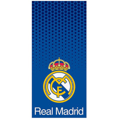 Real Madrid CF Blue Towel LKT Sport Large soft to touch 100% cotton velour beach towelSpotted blue towel featuring a full colour Real Madrid club crestOfficial licensed productApprox 140cm x 70cm (55in x 28in) Beach Towels
