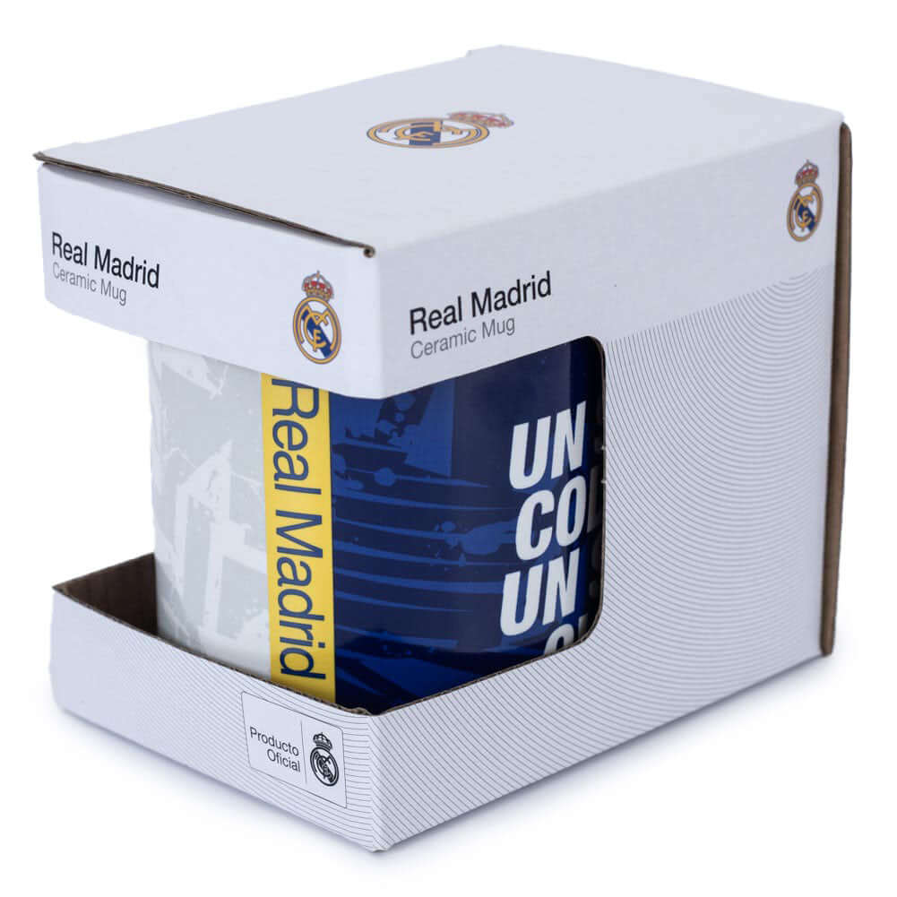 Real Madrid CF One Colour One Club Mug LKT Sport Ceramic everyday coffee mughalf and half blue and white fragment design with Real Madrid text on a yellow flashfull colour crest and 'one colour one club' slogan in english and spanishBlue inner with club c
