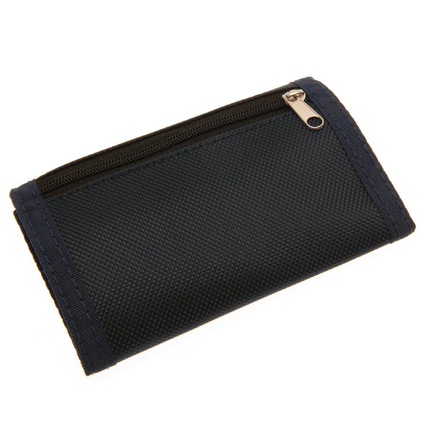 Tottenham Hotspur FC Ultra Wallet LKT Sport Ultra design wallet featuring a full colour club crest5 separate internal compartmentsExternal zipped pocketWipe clean polyesterOfficial licensed productApprox 12cm x 8cm closed Wallets